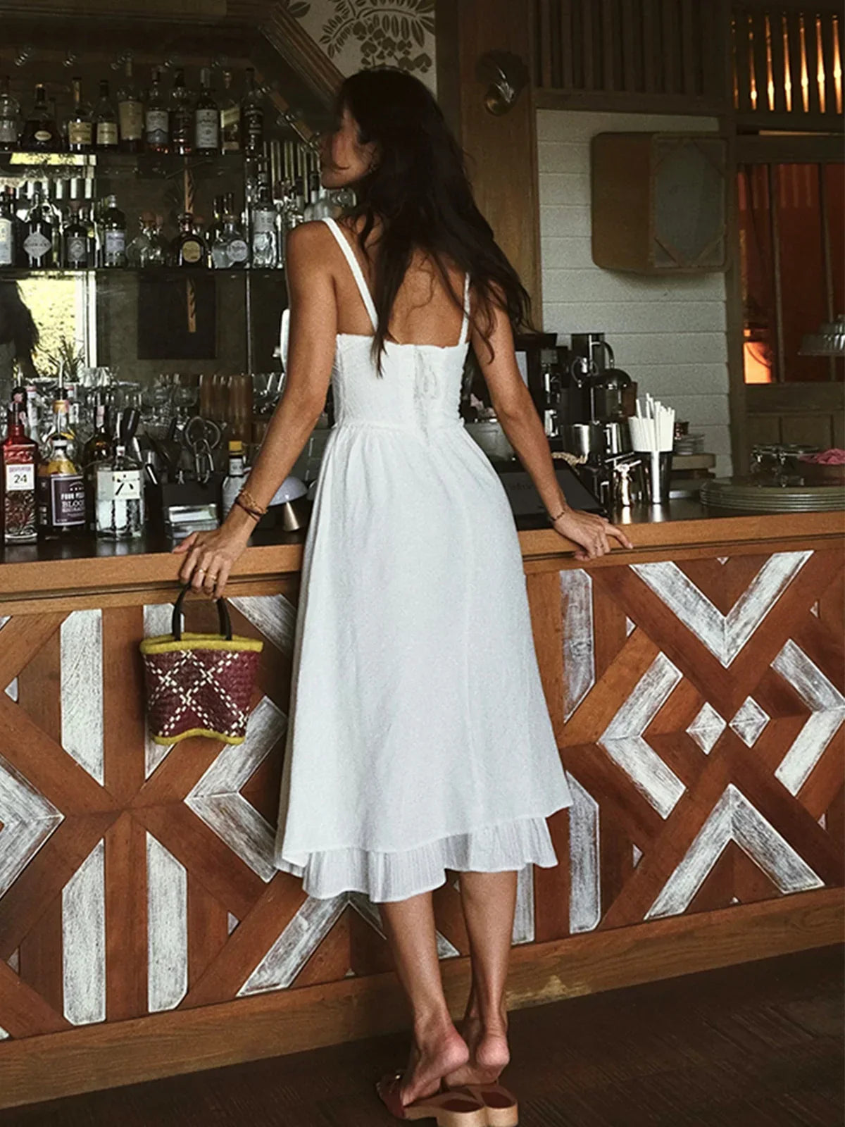 Iris | Solid color midi dress with thin straps and ruffle at the hem