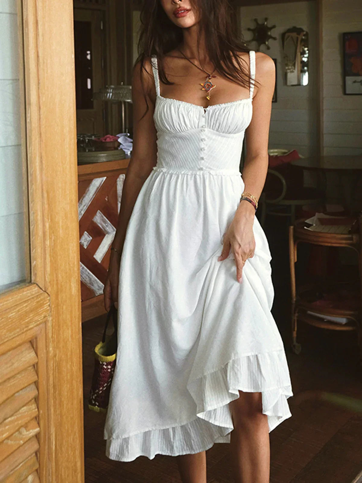Iris | Solid color midi dress with thin straps and ruffle at the hem