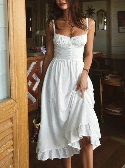 Iris | Solid color midi dress with thin straps and ruffle at the hem