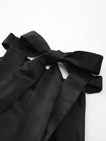 Carolina | Mini pleated satin dress with knot, double pockets, and open back